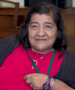 Smiling woman in red shirt.