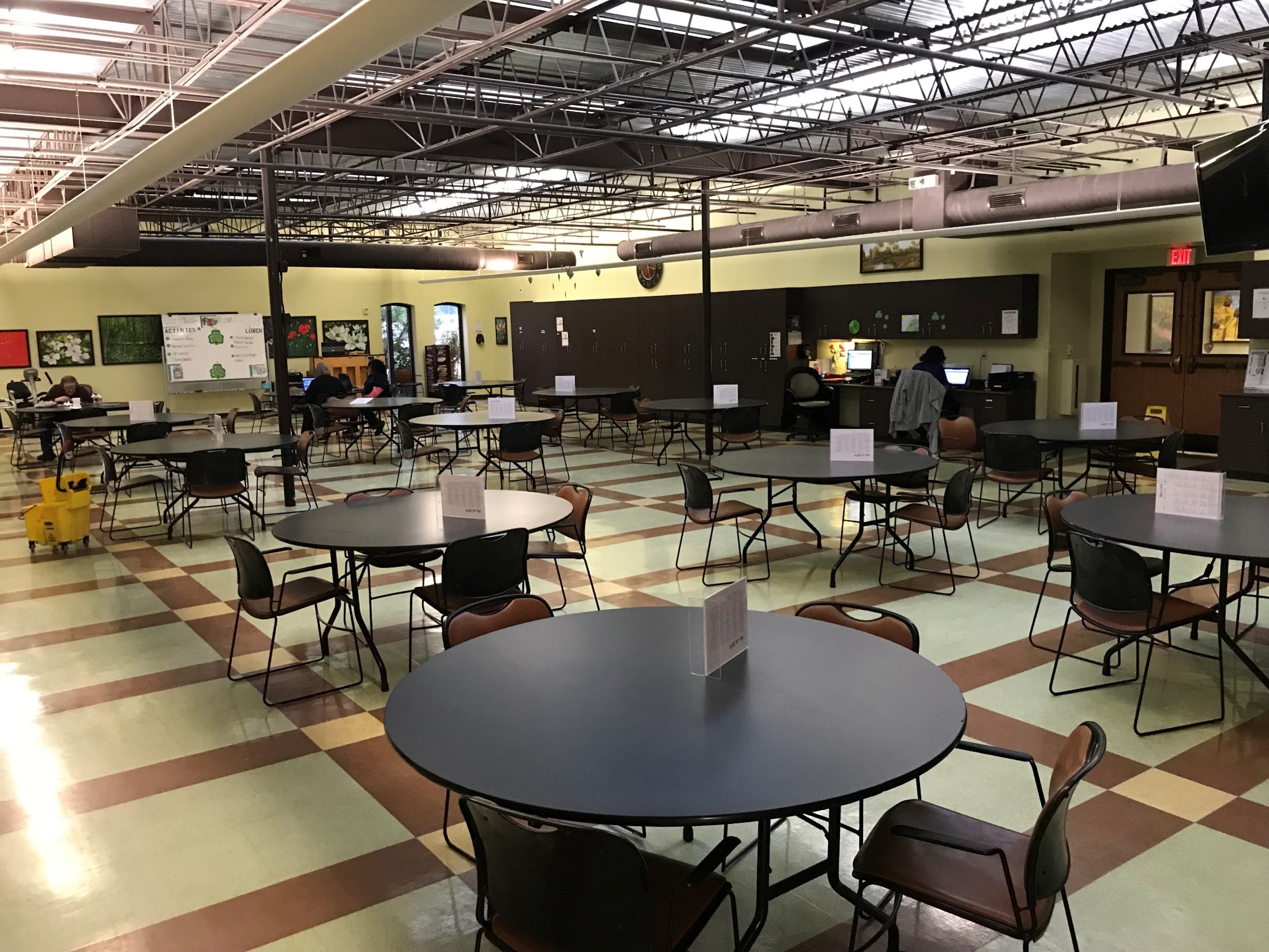 Empty dining area with round tables.